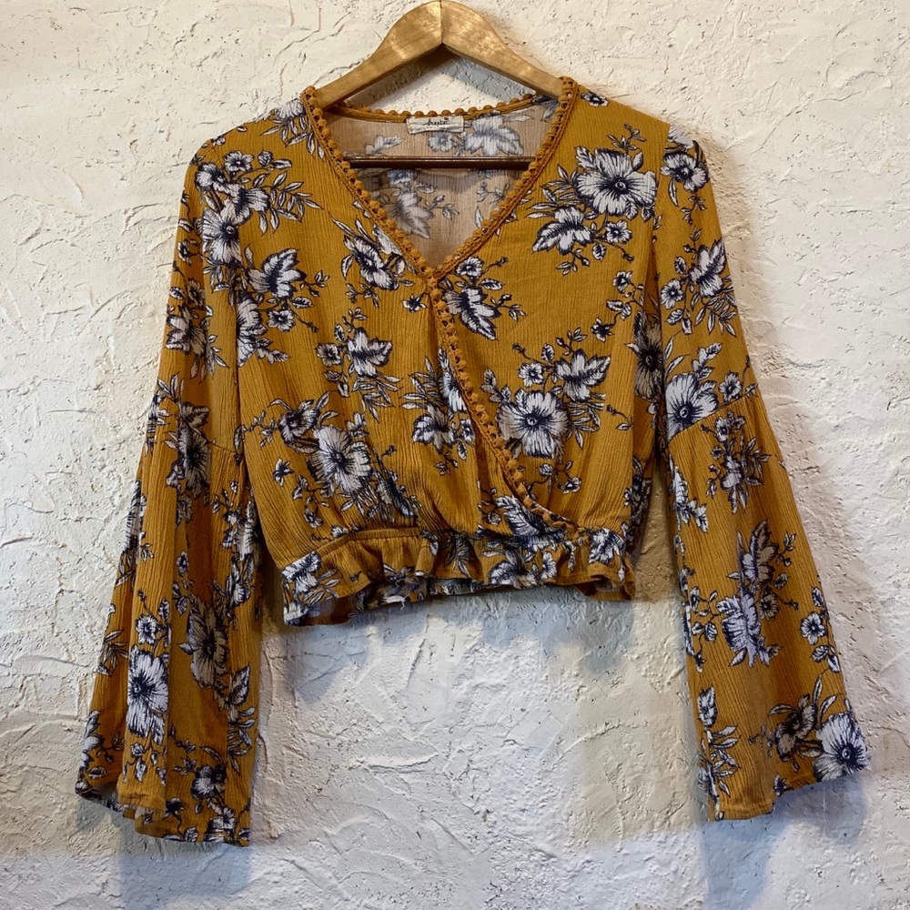 Yellow long sleeve crop top with flower pattern